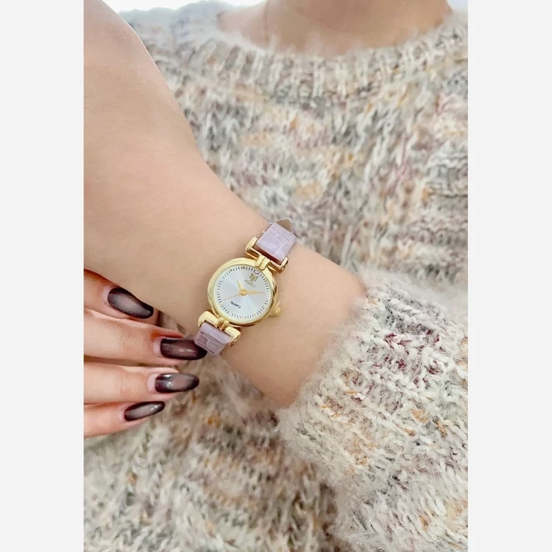 ساعت مچی زنانه ودخترانه ایکس  میل قاب طلایی بندچرمی کیفیت بینظیر