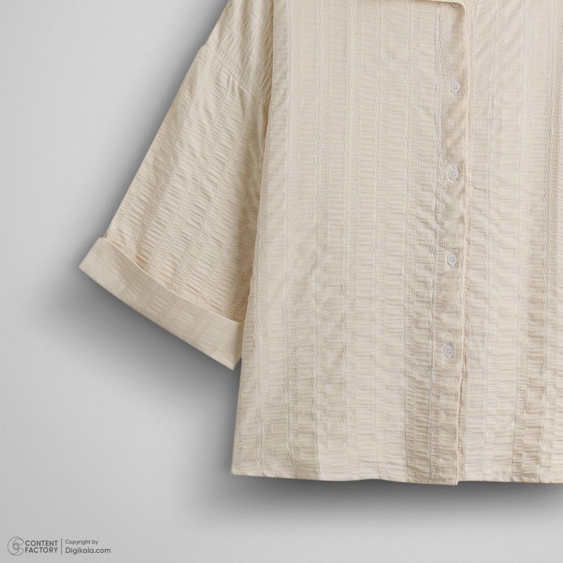 شومیز زنانه آستین سه ربع مدل 202 با یقه برگردان، جنس نخ، طرح راهراه، تنخور آزاد و قد روی باسن، مناسب استفاده روزمره و...